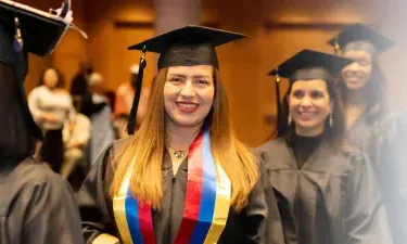 Herzing Michigan Online BSN Student Smiling at Graduation Ceremony