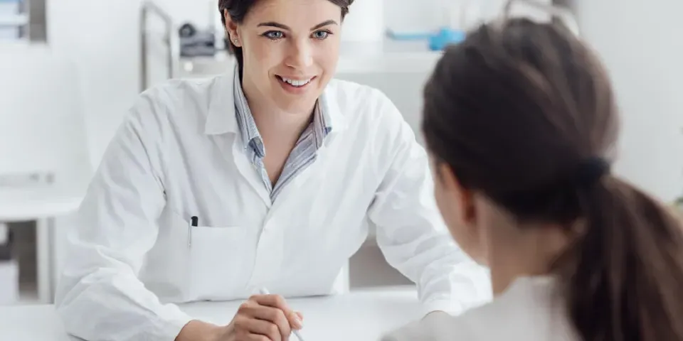 Nurse Practitioner with DNP Speaking with Patient